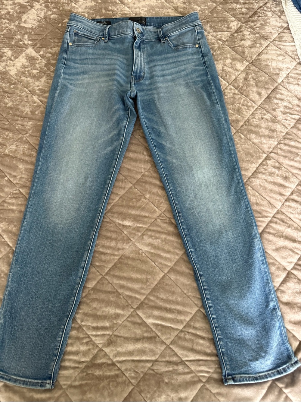White House Black Market  light wash mid rise Slim Straight Jeans. Size 12